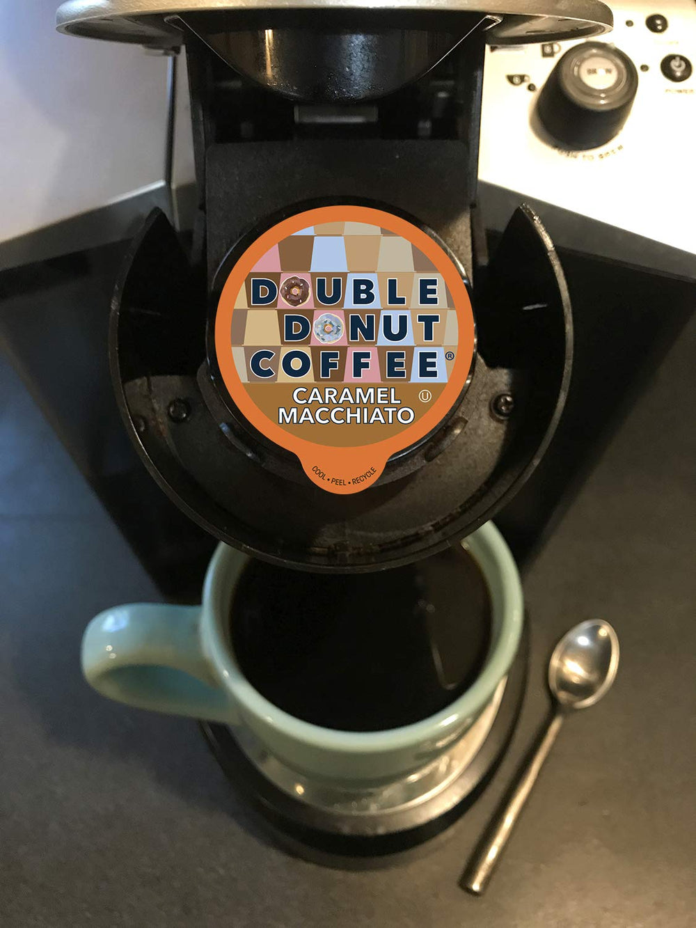 Double Donut pod beside a standard coffee cup to show serving scale and convenience