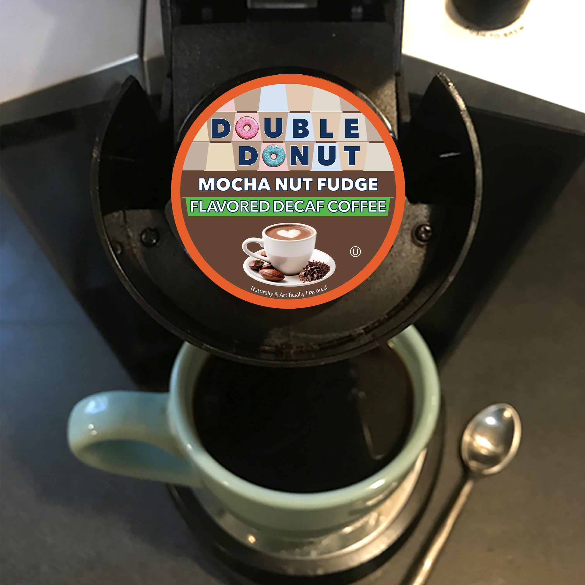 Double Donut pod in hand for scale showing single-serve convenience