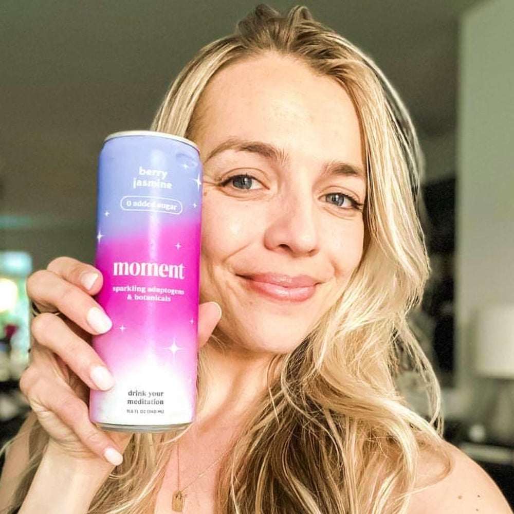 Drink Your Meditation can in hand to show scale and portable convenience