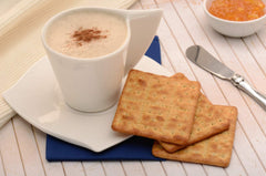 DUCALES cracker topped with cheese, ideal pairing and savory serving idea