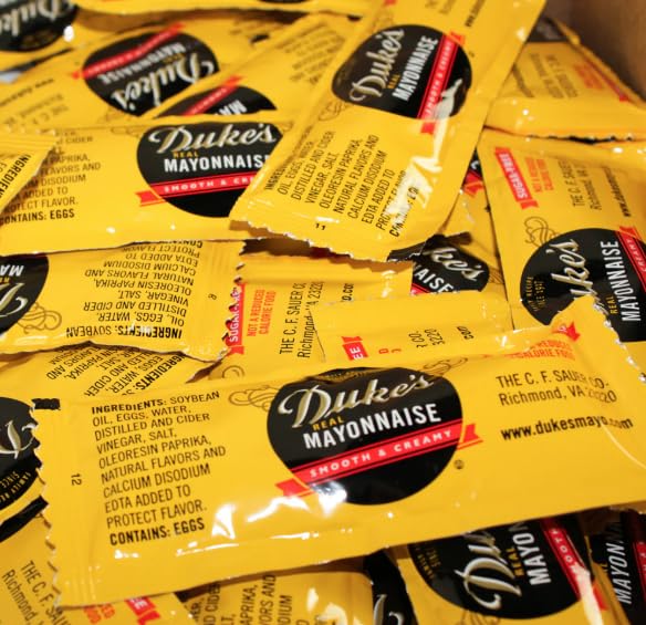 Dukes mayo packet open portion closeup displaying smooth texture for easy spreading
