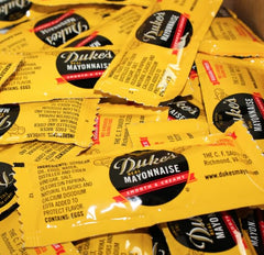 Dukes mayo packet open portion closeup displaying smooth texture for easy spreading