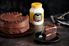 Close up of spoon scooping DUKE'S mayonnaise, demonstrating creamy whipped texture benefit