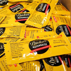 DUKE'S packet next to coin for scale, 12 g portion clarity and portion control
