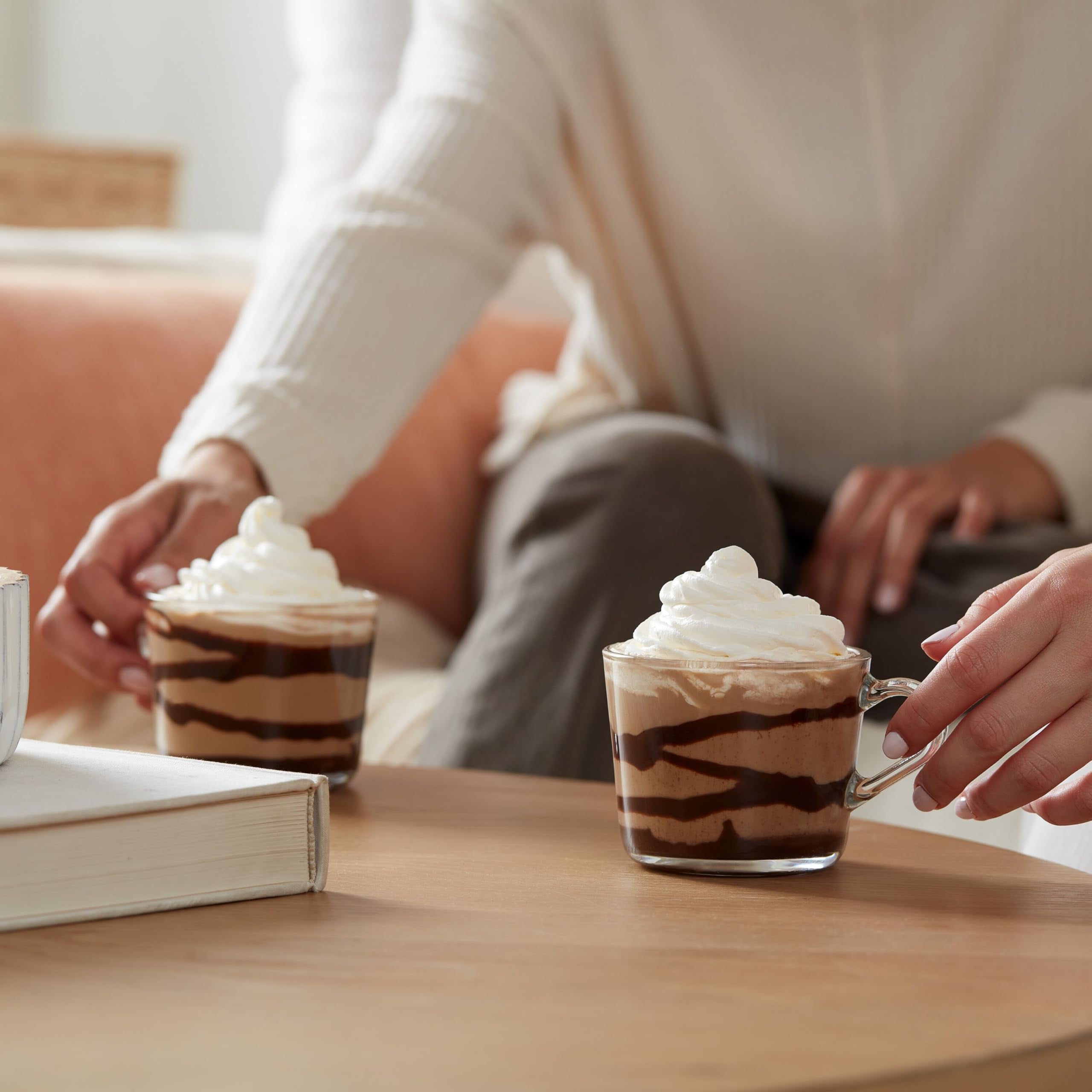 Dunkin' cup on breakfast table with pastry suggesting indulgent morning enjoyment
