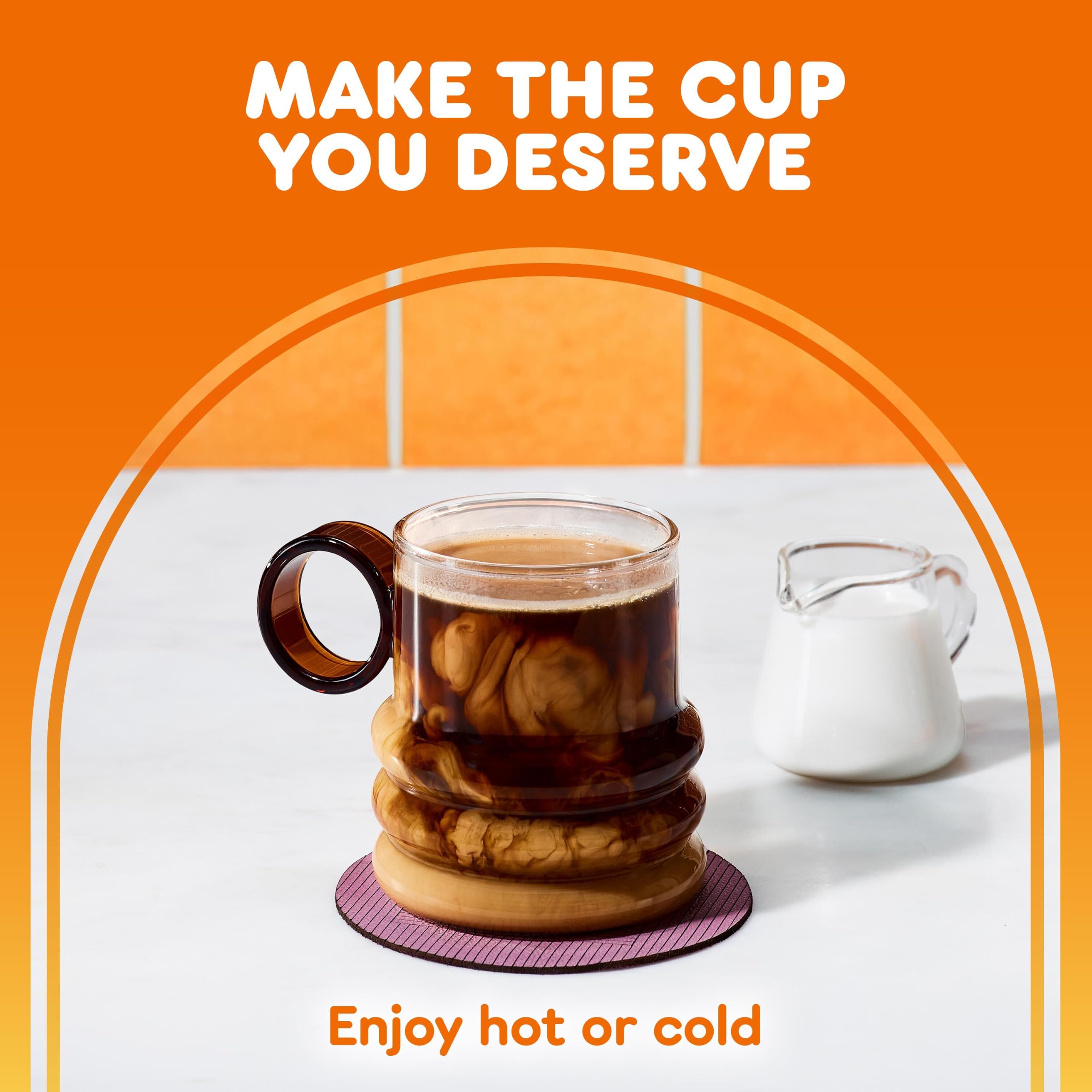 Cup of brewed Dunkin’ decaf beside a bag in a kitchen setting, comforting at home