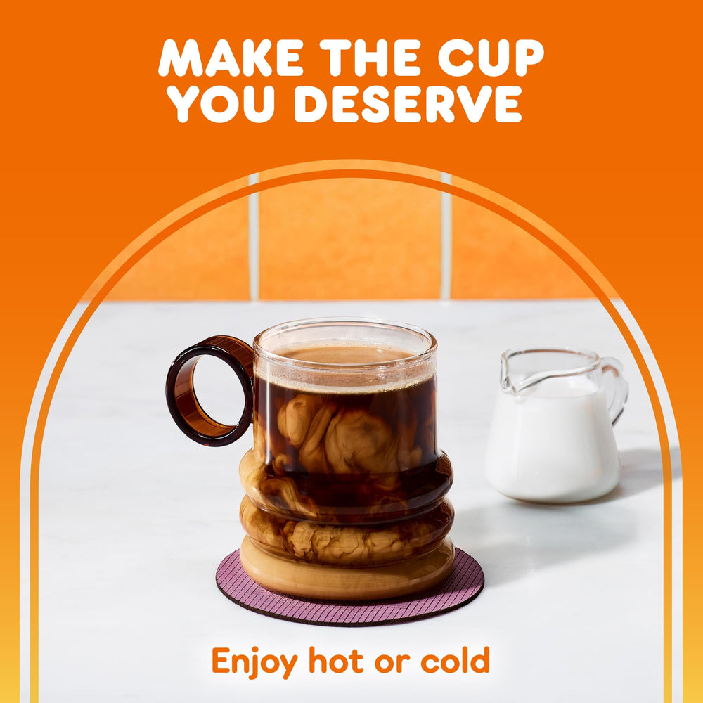 Dunkin' pod held in hand for scale showing compact single-serve portion