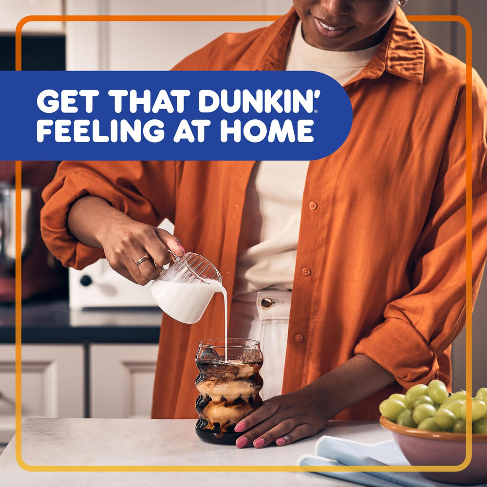 Dunkin' iced French Vanilla in a glass showing refreshing dessert-style drink