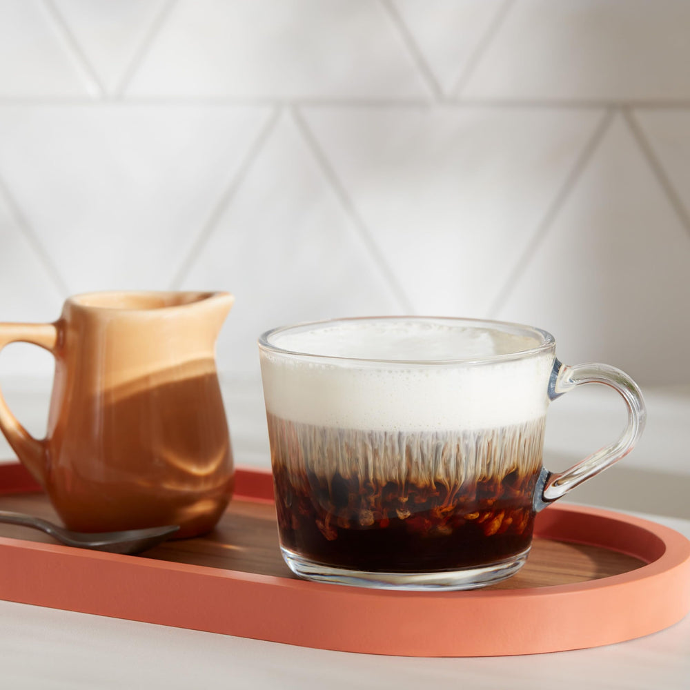 Dunkin' pod inserted in Keurig machine demonstrating straightforward single-serve brewing