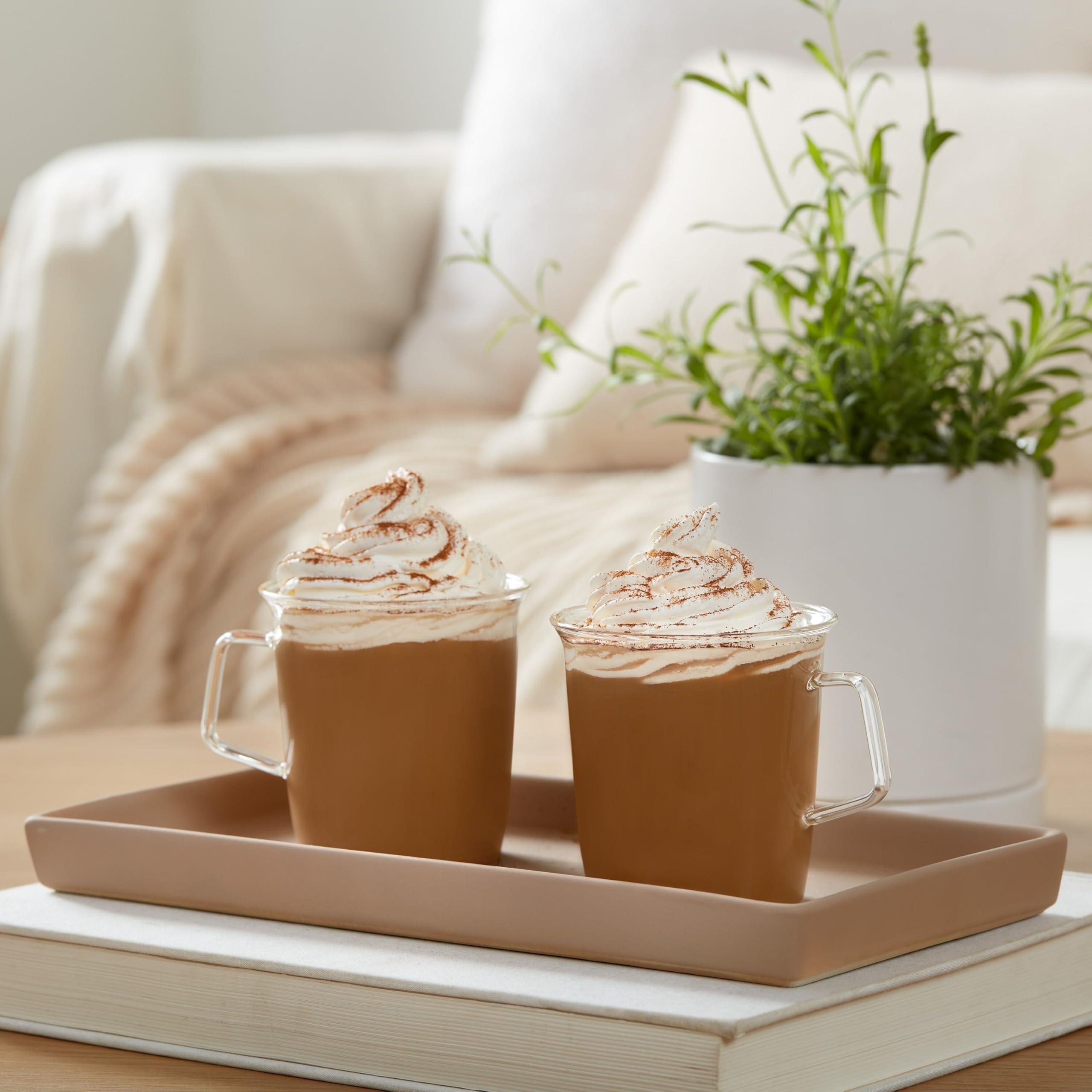Dunkin' cup and cozy setting showing seasonal enjoyment at home
