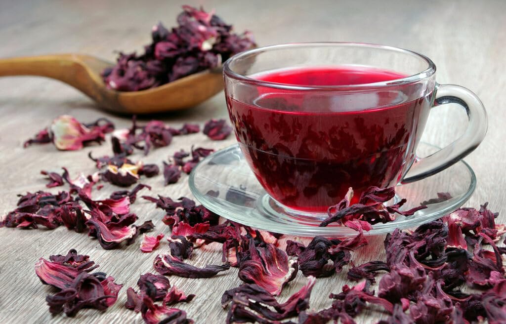 EarthWise Aromatics brewed hibiscus tea in a pitcher illustrating vibrant color and serving suggestion