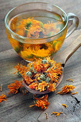 EarthWise Aromatics close-up of loose calendula petals texture and vibrant golden color