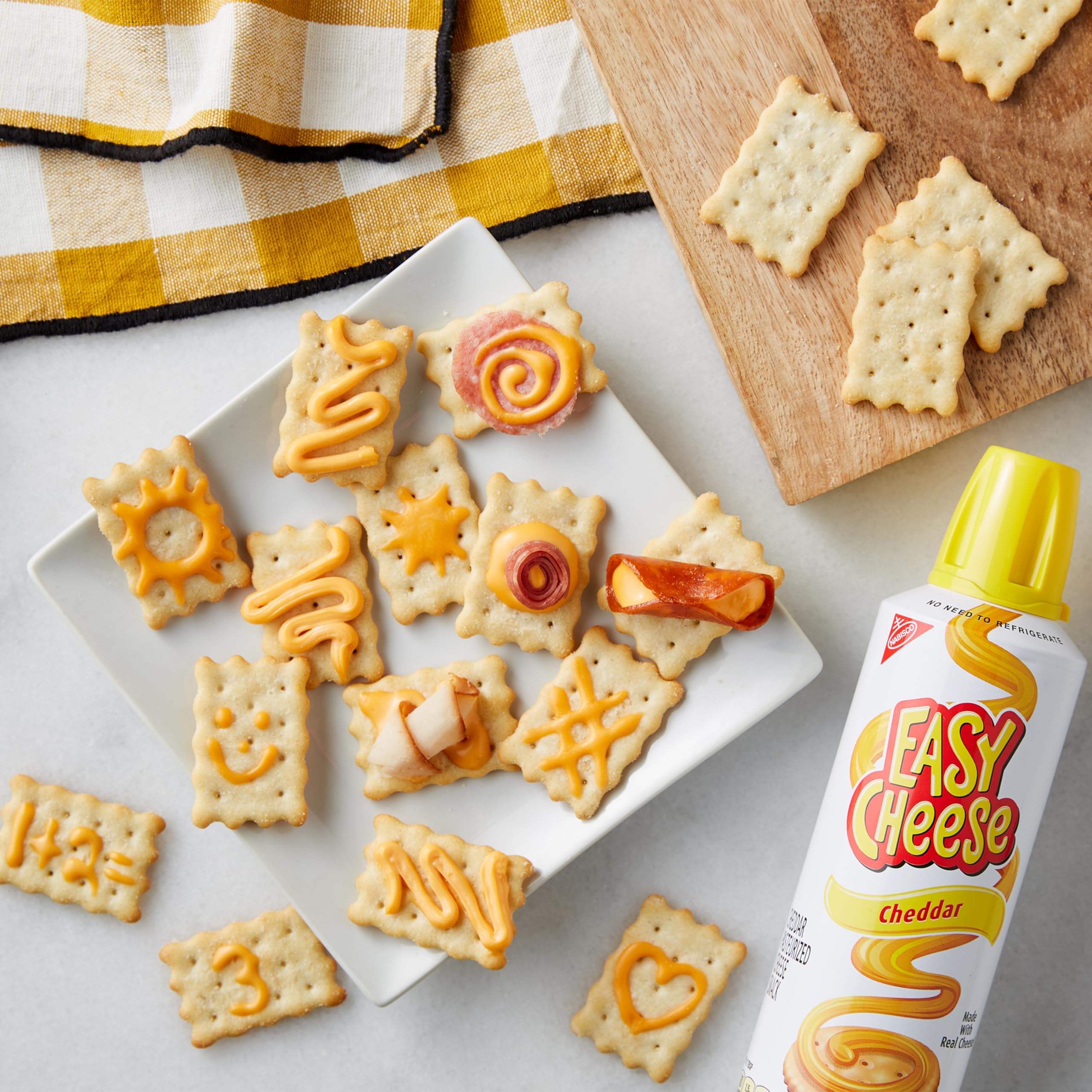 EASY CHEESE beside an 8 oz measure for size comparison and portion clarity