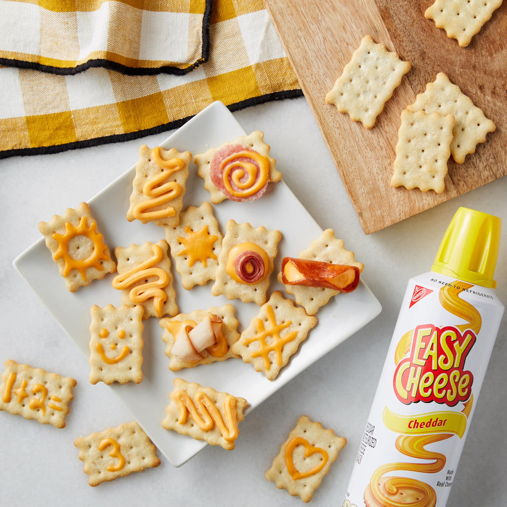 EASY CHEESE beside an 8 oz measure for size comparison and portion clarity