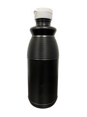 eclipse pint bottle next to a glass and spoon, size comparison for portion planning