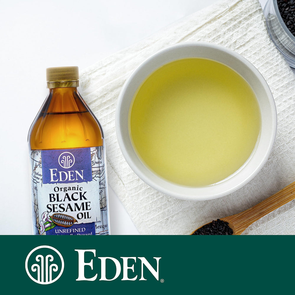 Eden Organic black sesame oil sizzling in skillet to boost savory dishes