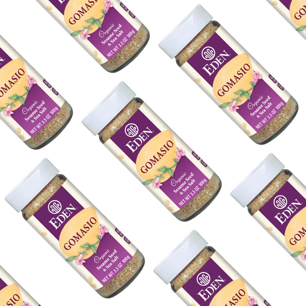 Eden Foods gomasio held in hand showing 3.5 oz jar size and scale