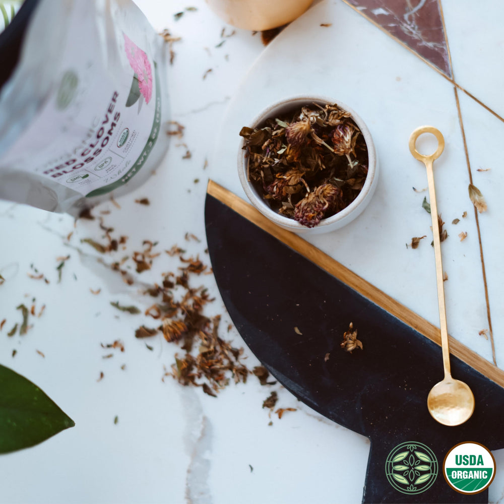 Elanen Naturals spoon with portion next to scale showing accurate 2 oz serving