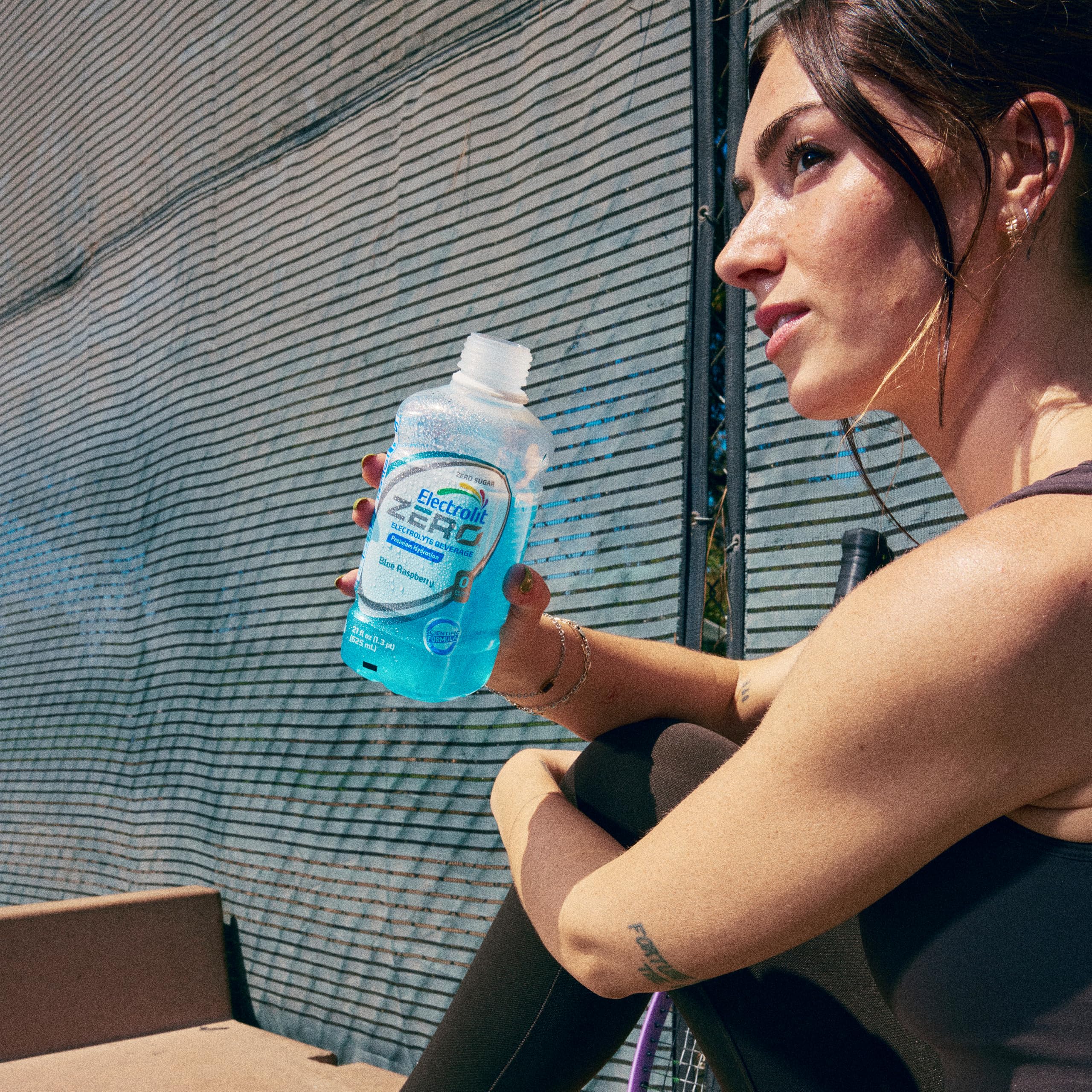 Electrolit bottle on gym equipment showing post-workout replenishment benefit