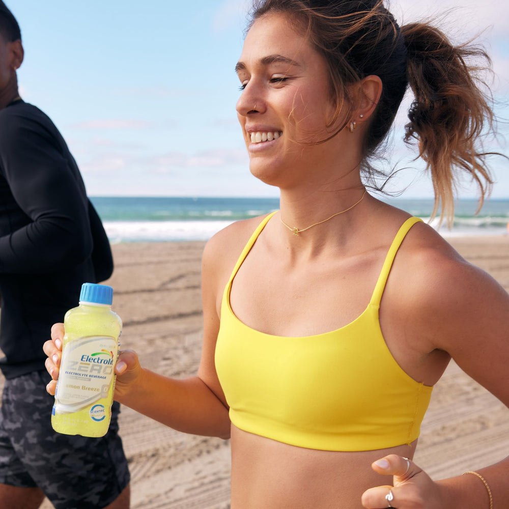 Electrolit bottle on outdoor table showing lemon breeze for on-the-go replenishment