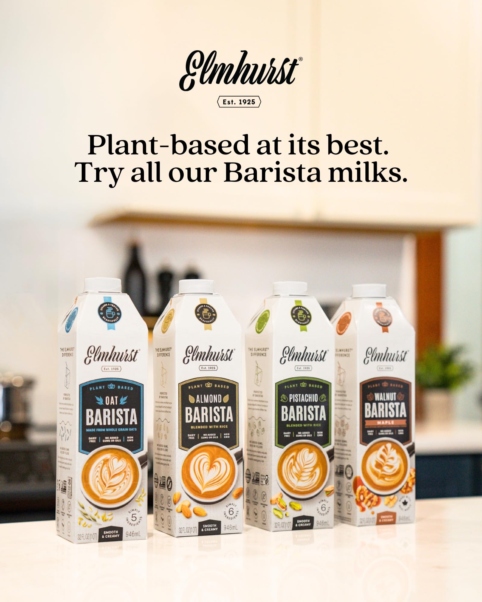 Elmhurst oat milk next to a cappuccino on kitchen counter showing café-quality results benefit