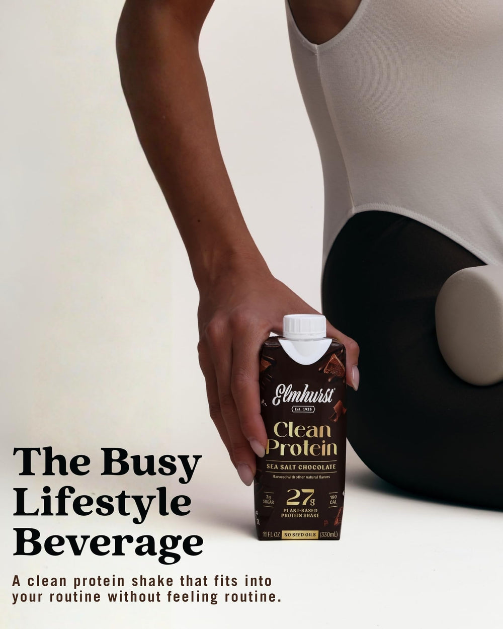 Elmhurst bottle in hand to show 11-ounce scale and portability benefit