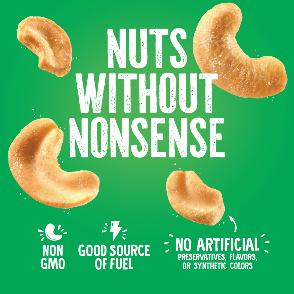 Emerald cashew pile next to a measuring scale showing portion control and calorie clarity