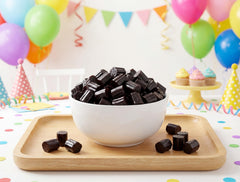 EMPORIUM candy open resealable bag revealing black licorice bites freshness