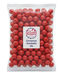 EMPORIUM CANDY close-up texture of glossy red cinnamon gumball highlighting crunchy shell and flavor