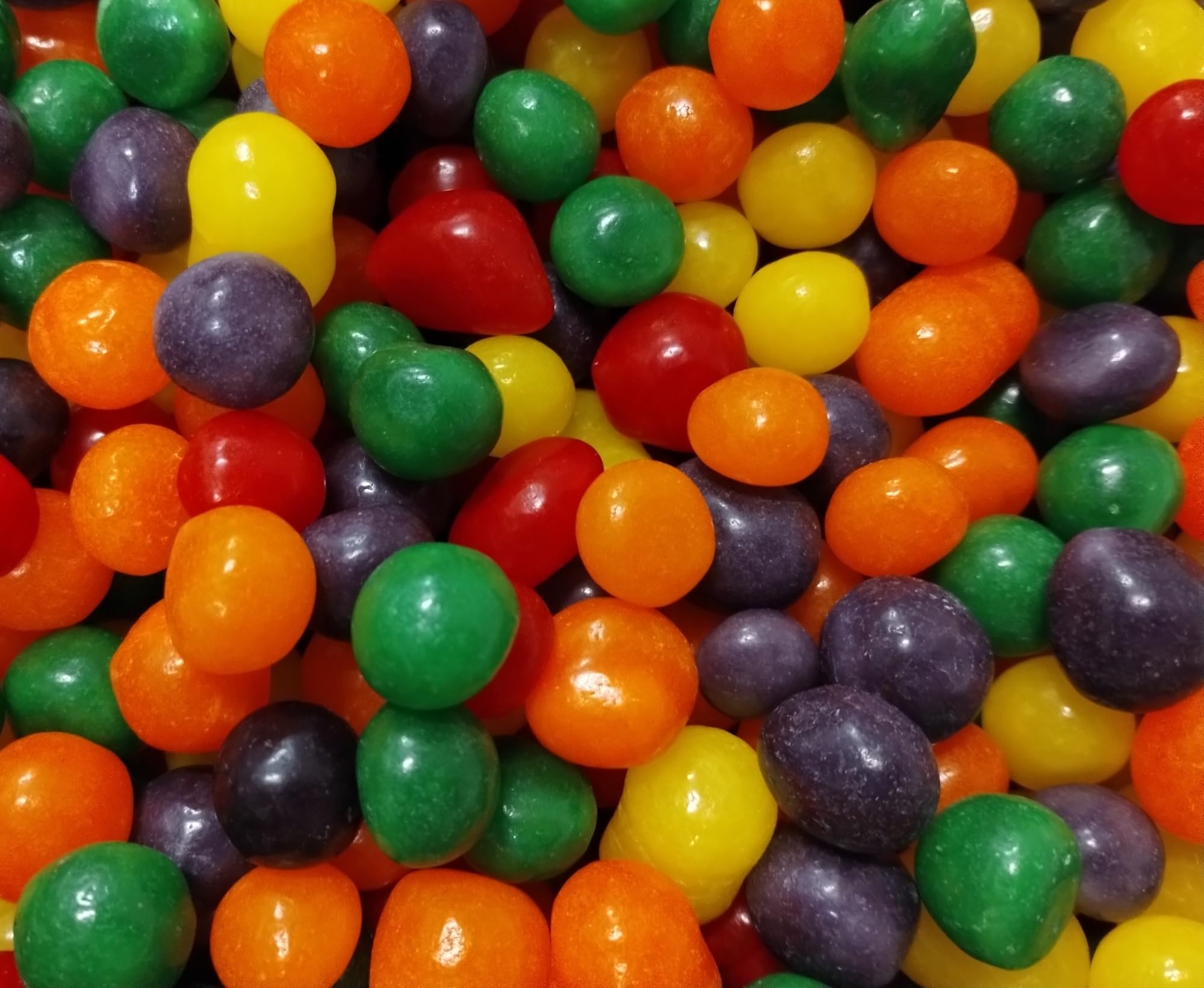 EMPORIUM close-up of candy texture highlighting chewy sour coating benefit