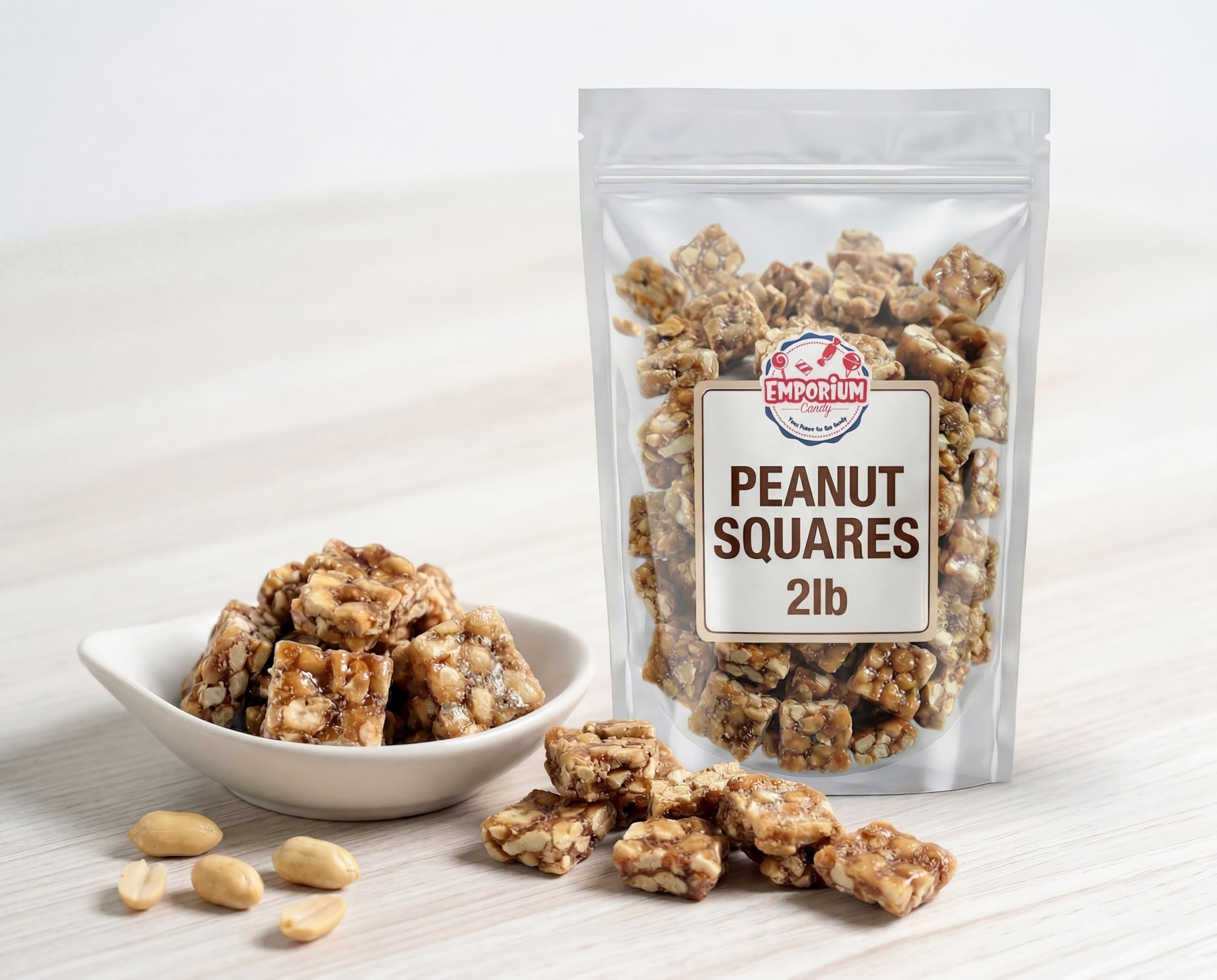 EMPORIUM single peanut square held to show size and satisfying crunch