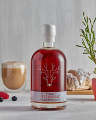 Escuminac drizzled over pancakes illustrating balanced sweetness for breakfast