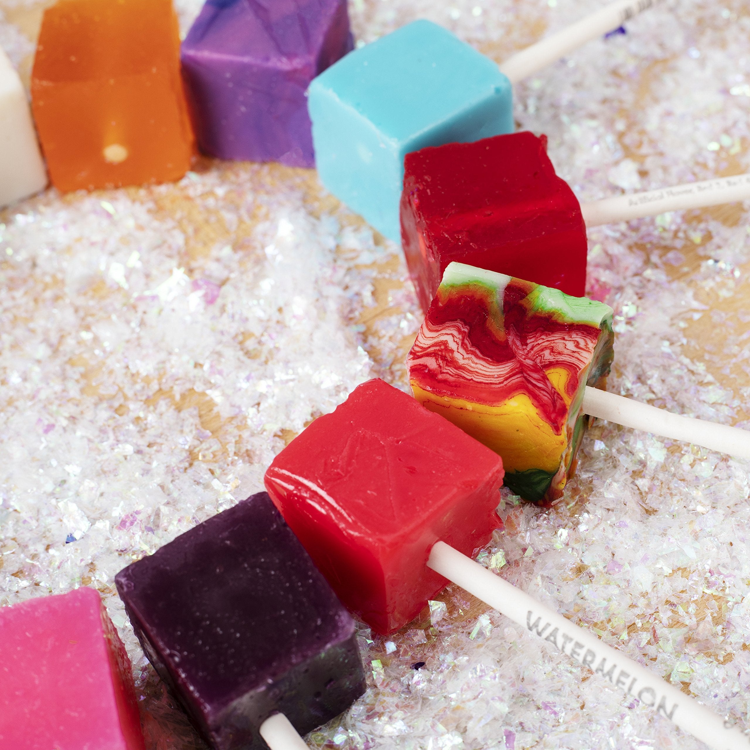 Espeez cube pop next to a ruler and stick showing size and individual wrapping convenience