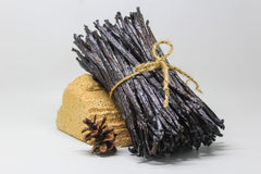 ESSENCE FOOD & BEVERAGE close-up of a split Java vanilla bean showing seeds and potency