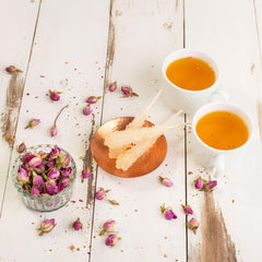 Eupherbia stick in teacup dissolving to sweeten beverage with elegant presentation