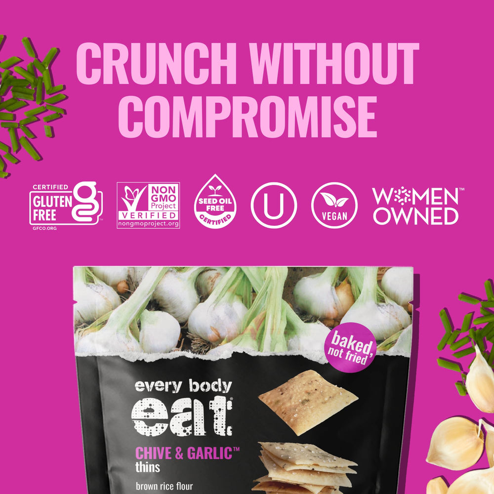 Every Body Eat crackers dipped in hummus demonstrating versatile pairing benefit