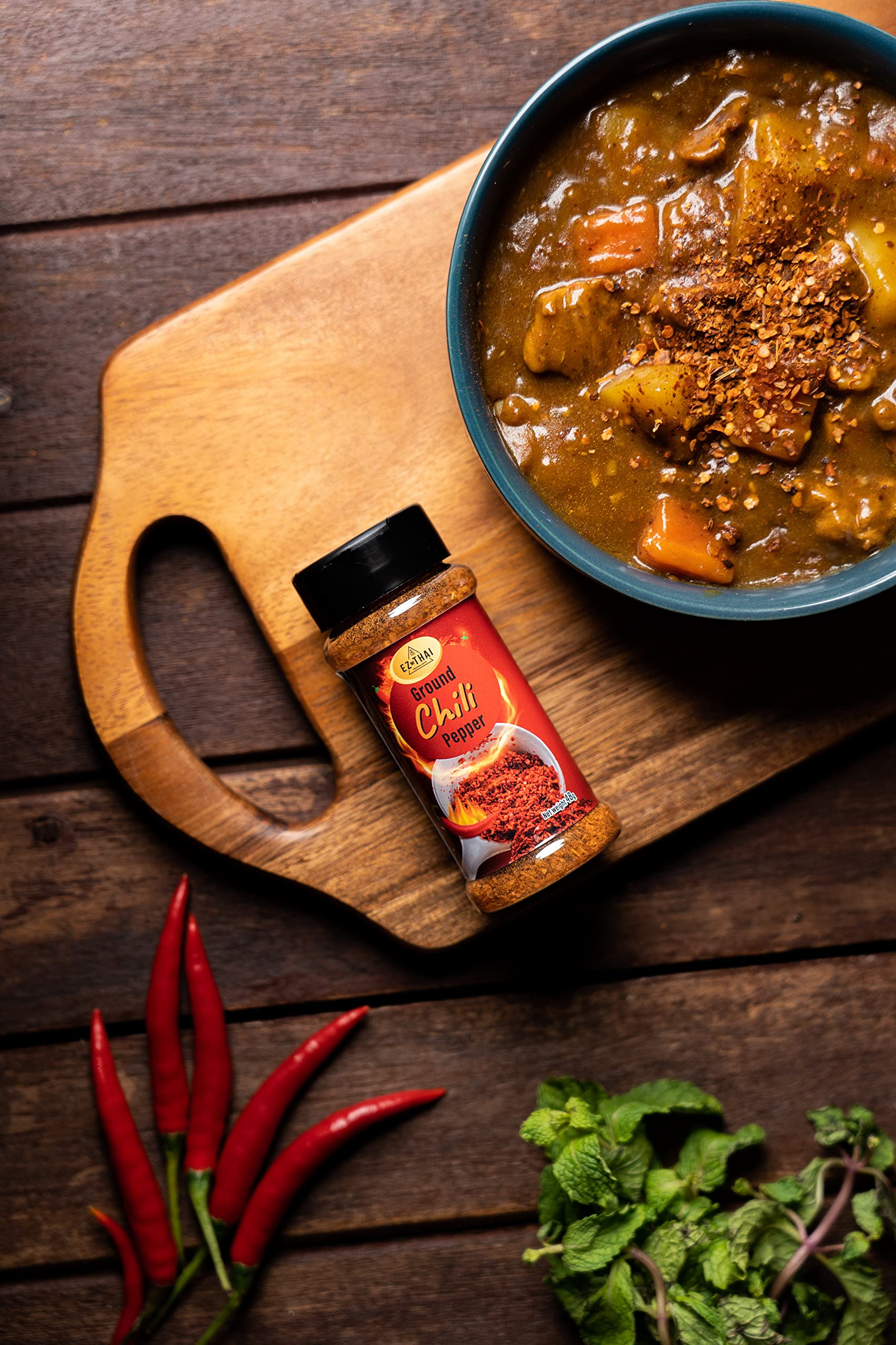 EZ THAI sprinkled on Tom Yum soup adding authentic Thai heat
