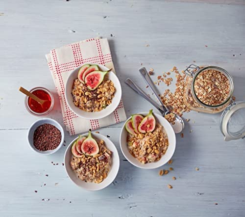 Familia muesli prepared as birchermüesli with grated apple showing creamy soaked texture
