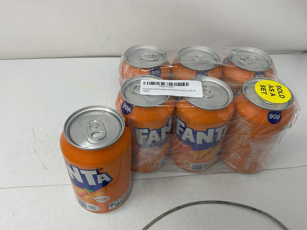 single 330 ml Fanta can next to a ruler showing compact size and portion
