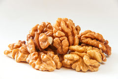 Farm Fresh Nuts detail of oil drizzle on walnuts enhancing even roast