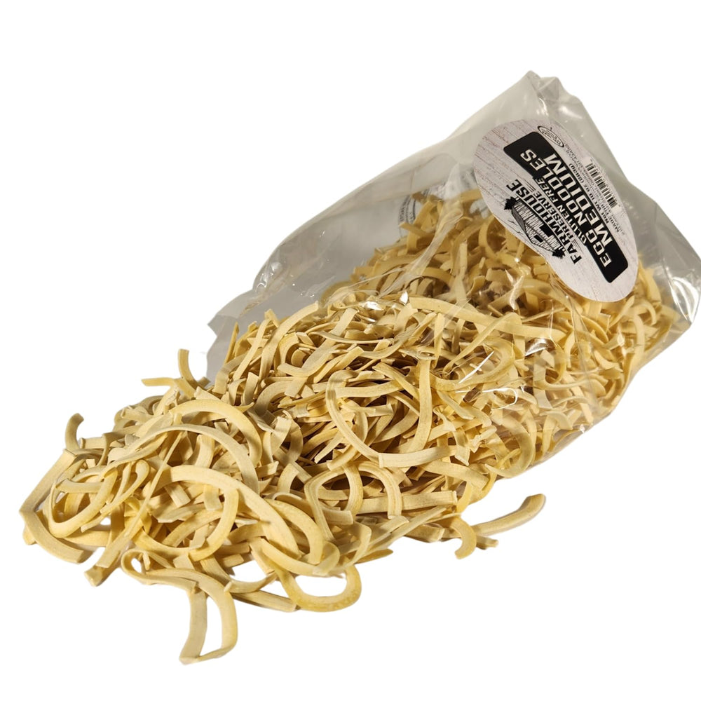 Close-up of Farmhouse Preserve double yolk noodle texture showing hearty bite
