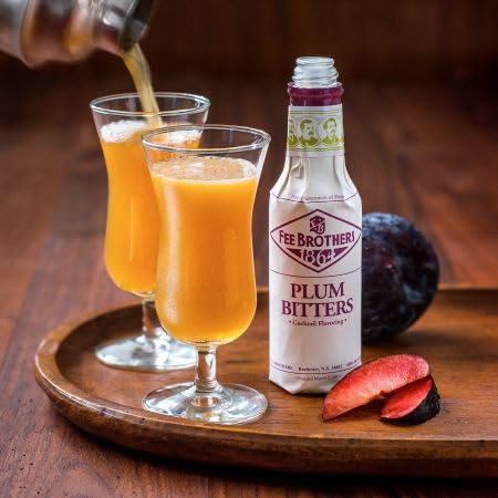 Fee Brothers plum bitters used in a cocktail glass as garnish adds balanced plum aroma and depth
