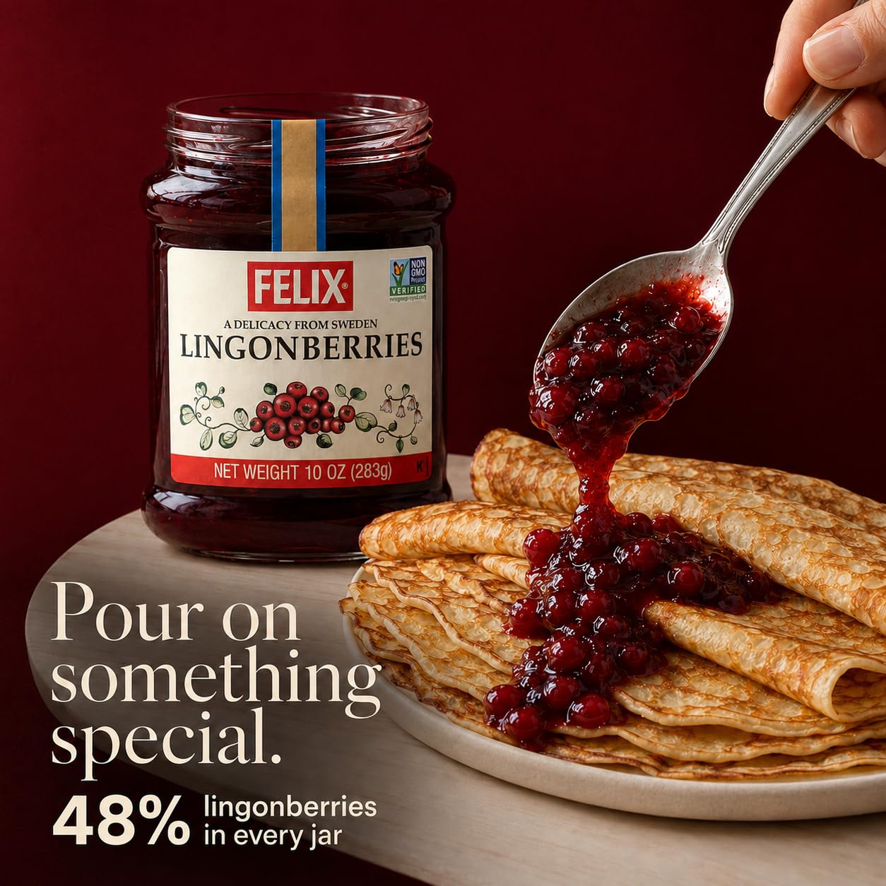 Spoonful of Felix lingonberries being served, showing vibrant color and ready-to-use benefit