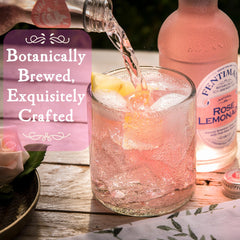 Fentimans pink lemonade poured into glass over ice, looks refreshing