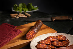 FERMIN Iberico chorizo arranged on charcuterie board enhancing entertaining presentation