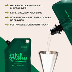 Filthy Food olive brine added to martini glass for enhanced cocktail flavor