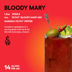 Filthy olive speared on a cocktail skewer adding spicy flavor to a martini