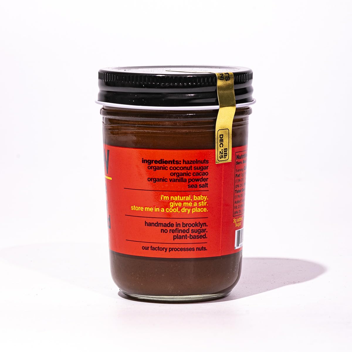 Fine & Raw close-up of creamy hazelnut butter texture showing rich cacao taste