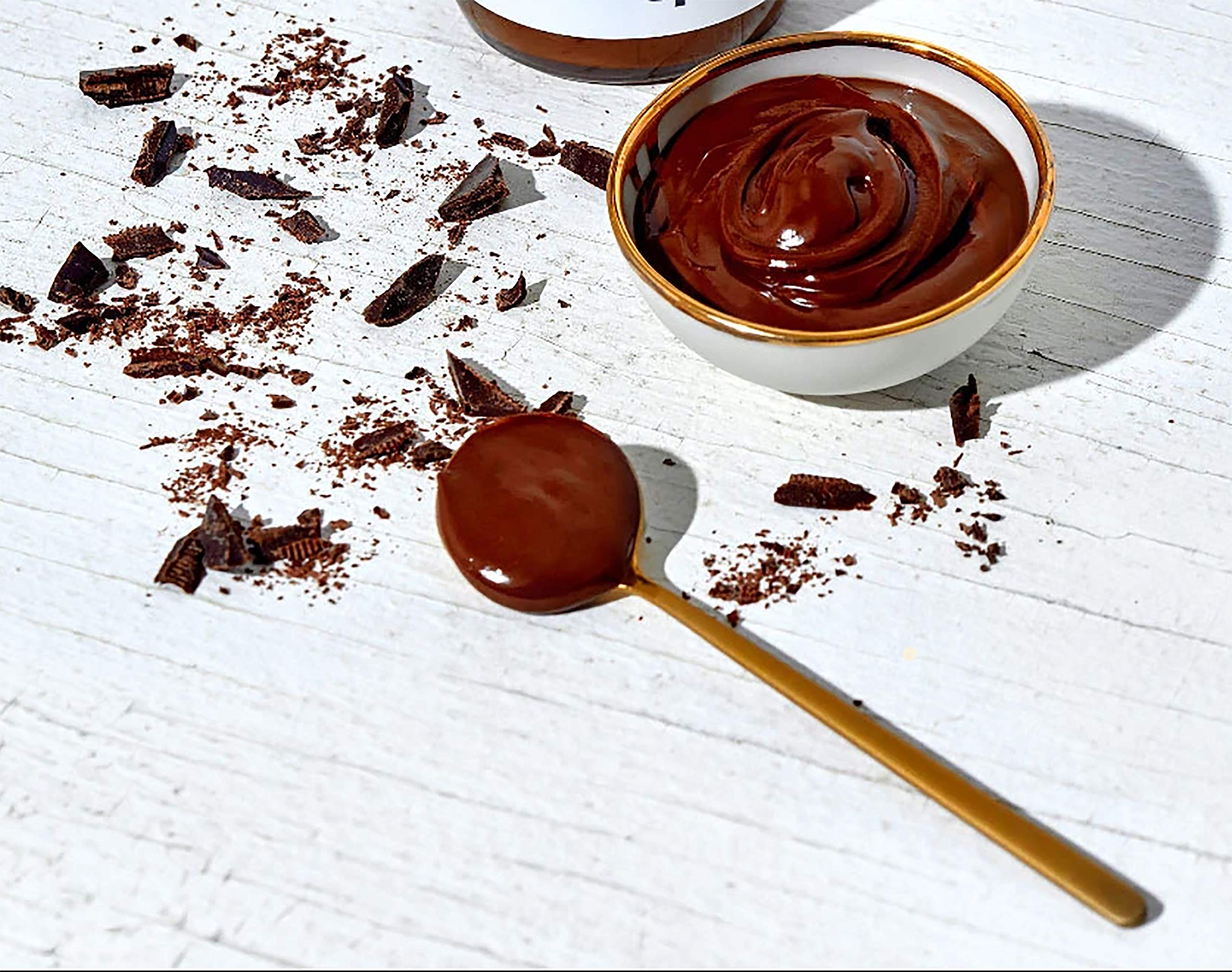 Fine & Raw overhead of hazelnuts and cacao beans emphasizing clean ingredients