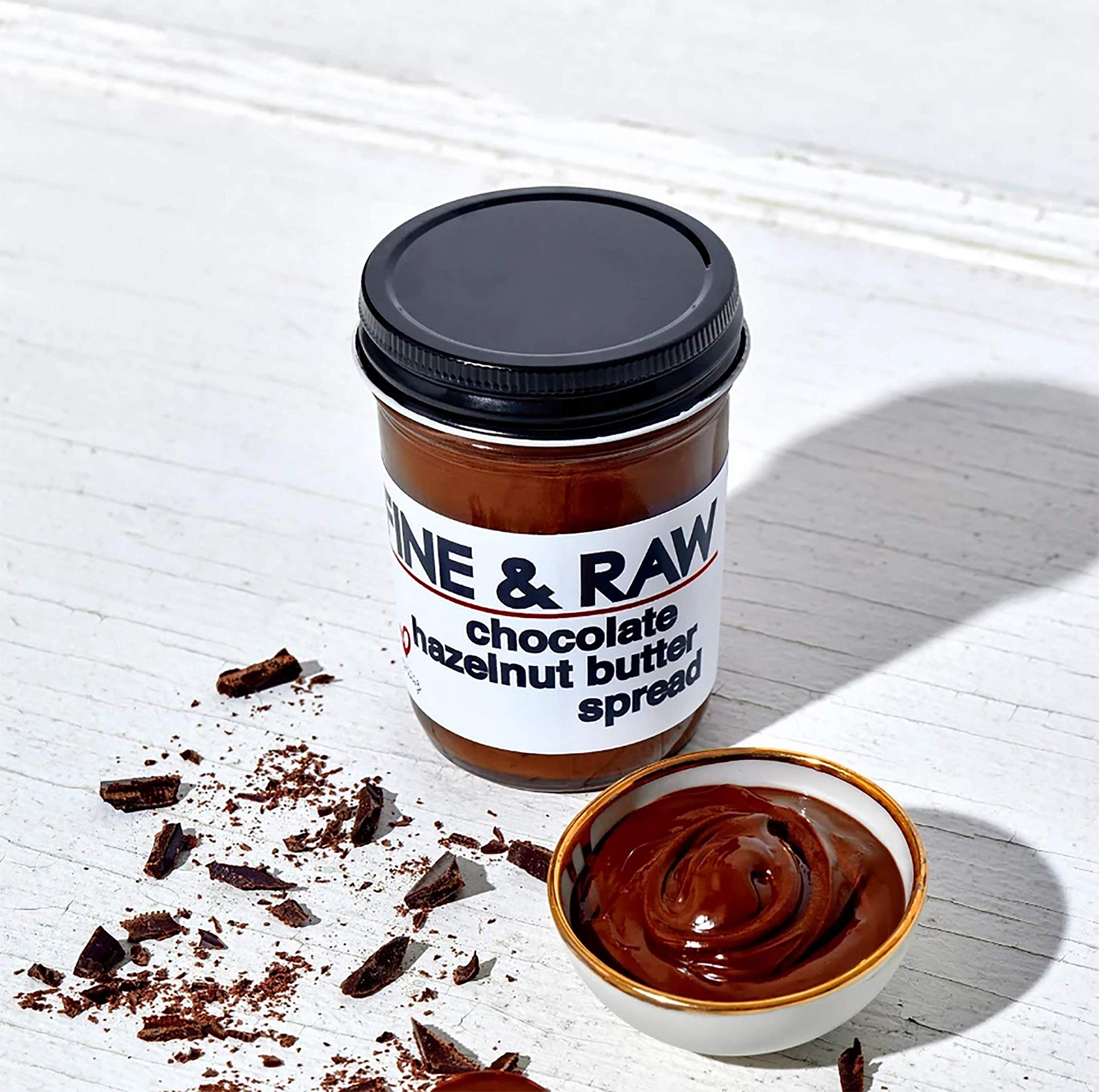 Fine & Raw jar on a styled breakfast table promoting indulgent vegan morning options